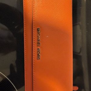 Orange wallet by Michael Kors